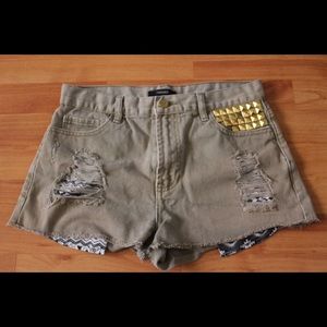faded green distressed shorts