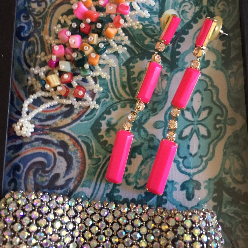 2 bracelets and pink earrings
