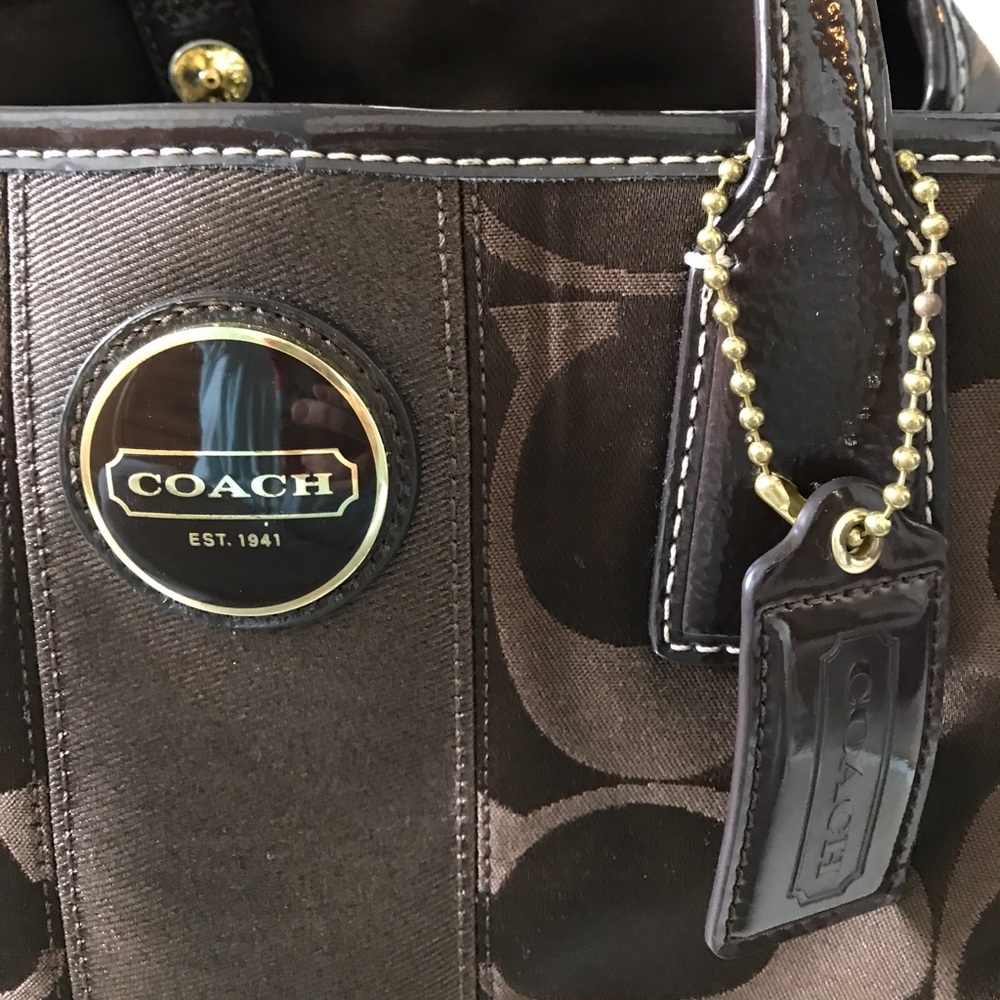 Beautiful classic Coach bag with clasped center