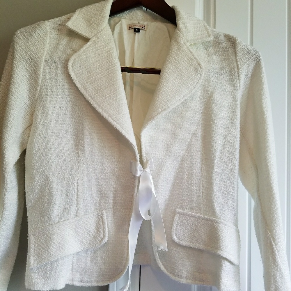 White jacket with ribbon closure