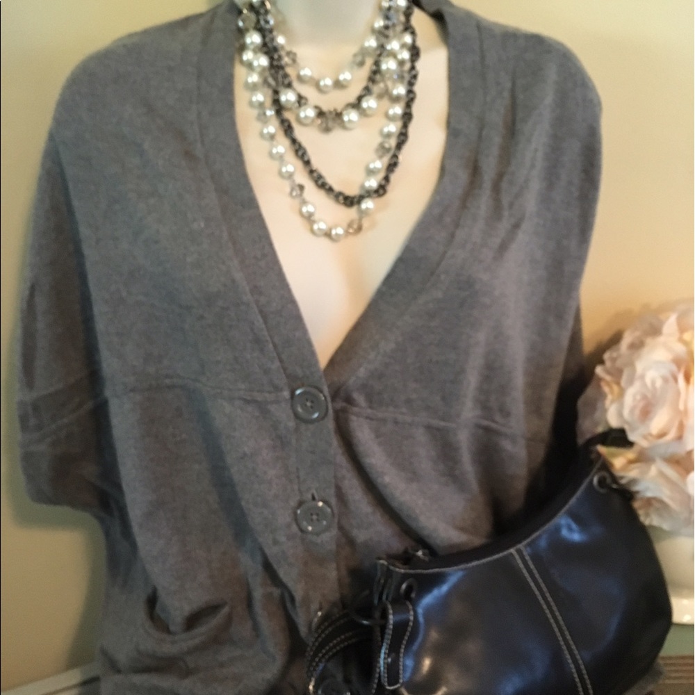 Grey soft sweater with a low ne