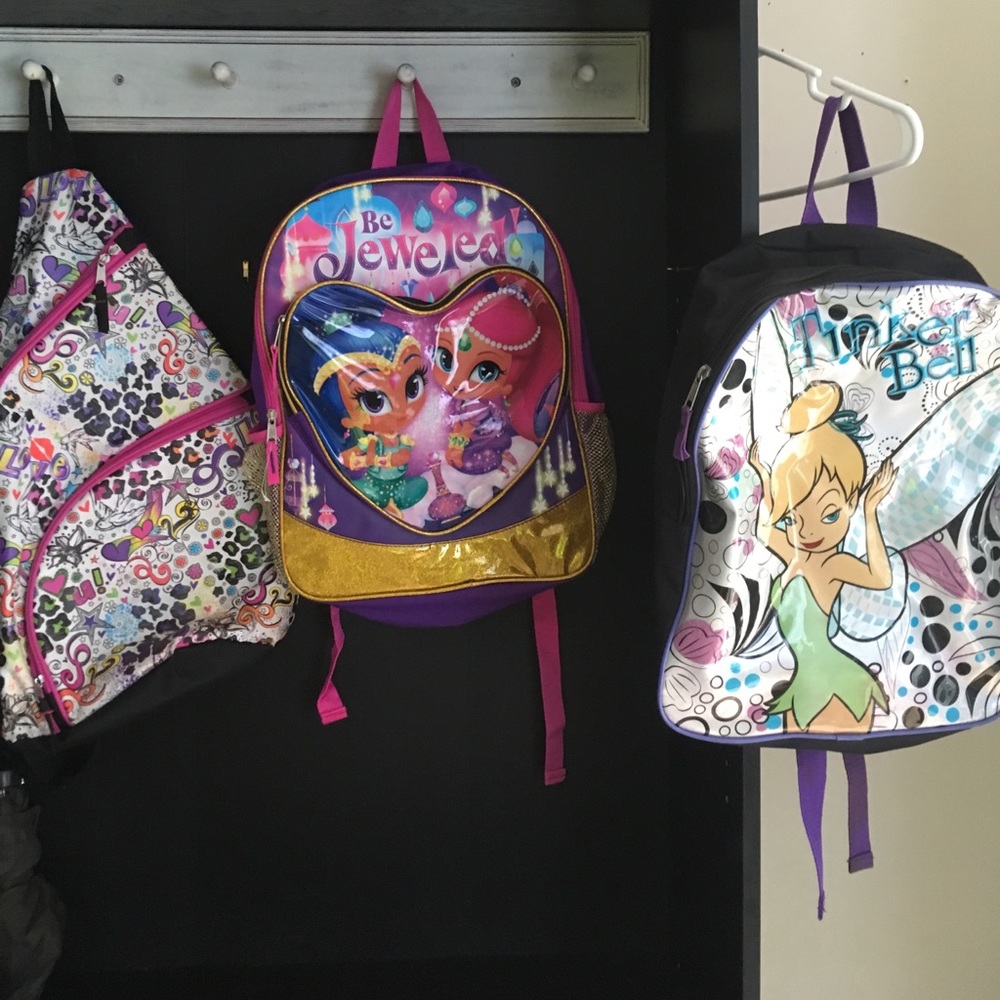 Little girl backpacks