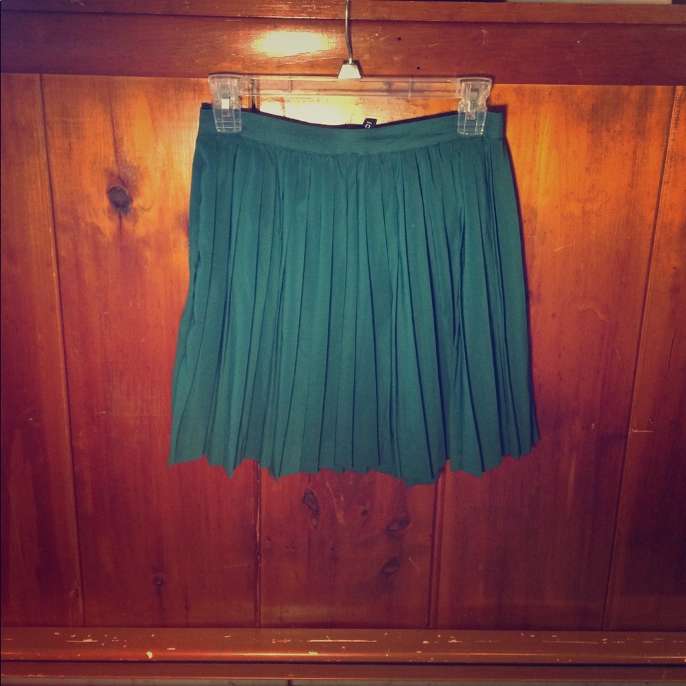 Green pleated skirt