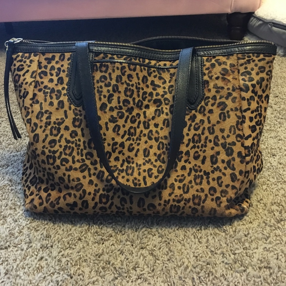 Fossil leopard fur purse