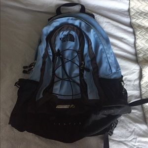 Blue north face book bag