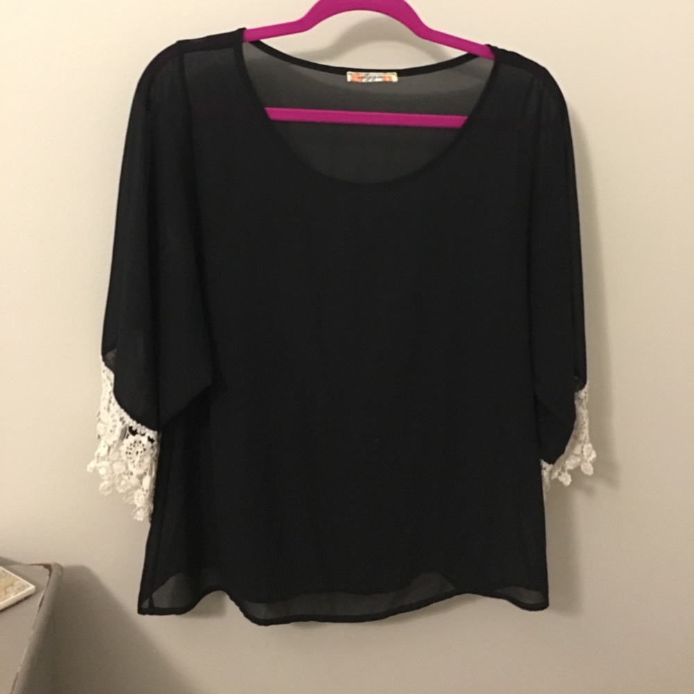 Semi sheer black top wth lace on end of sleeve