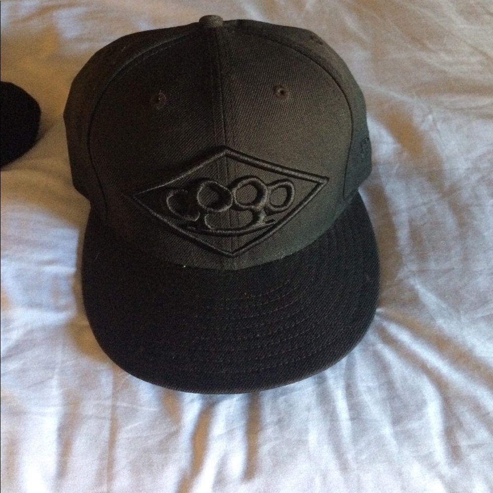 Hat with brass knuckles