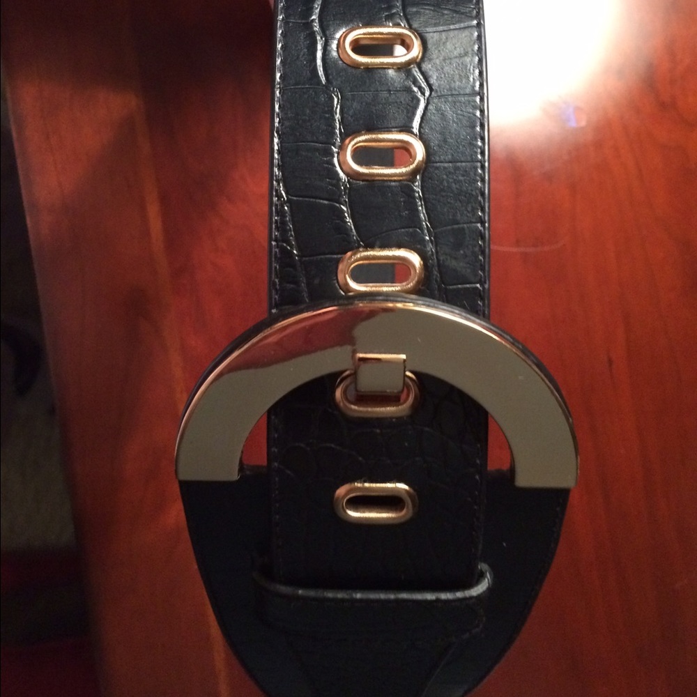 black belt with gold buckle