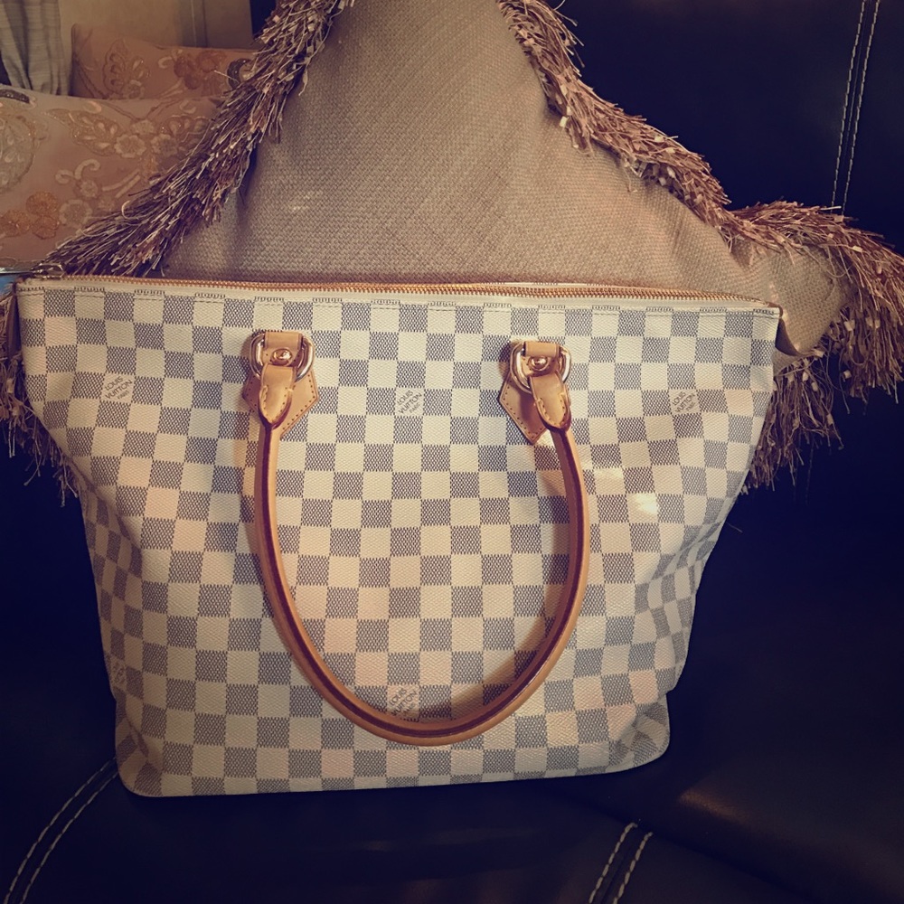 Authentic Louis Vuitton with white checkers.