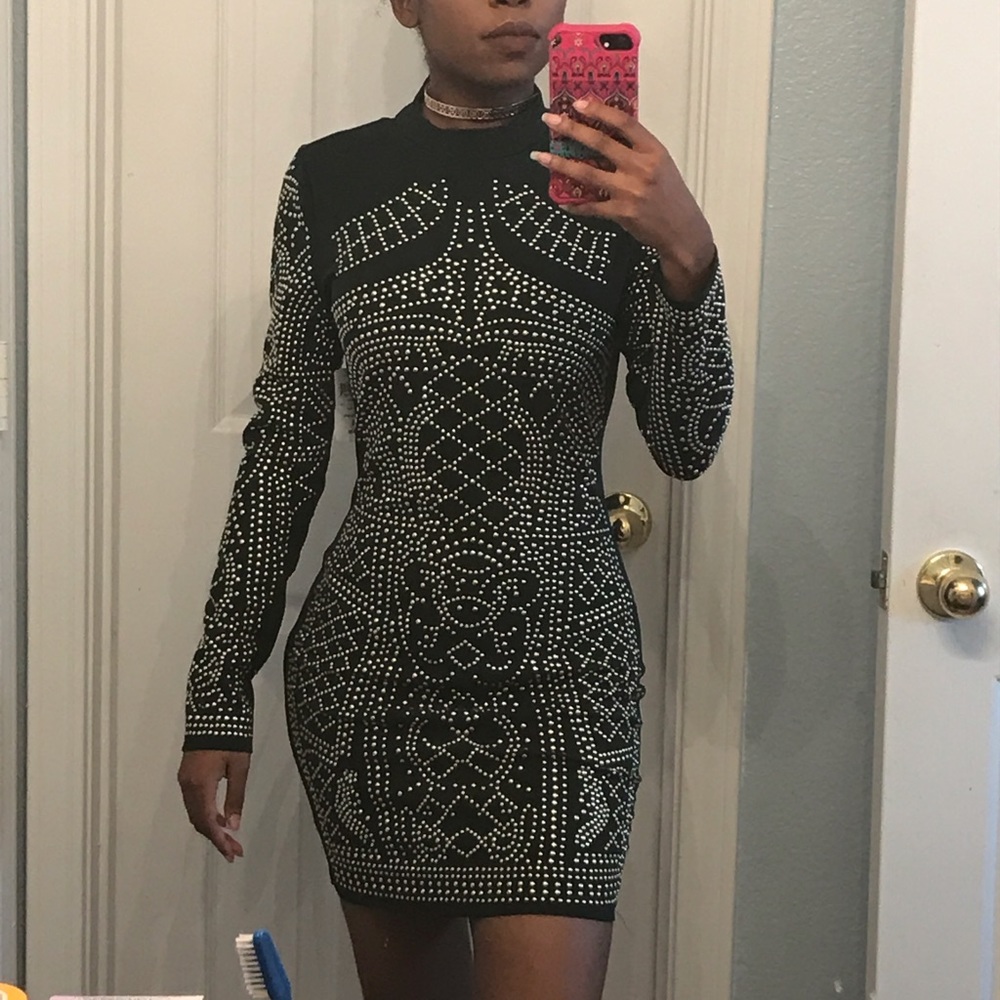 Long sleeve green dress with rhinestones.