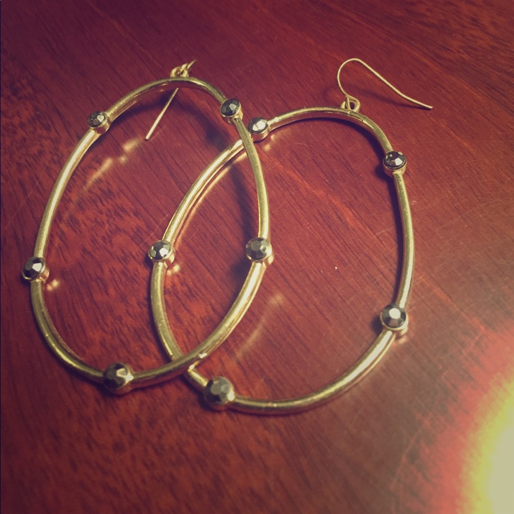 Gold earrings with black bead detail