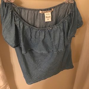 Off the shoulder ruffled denim shirt