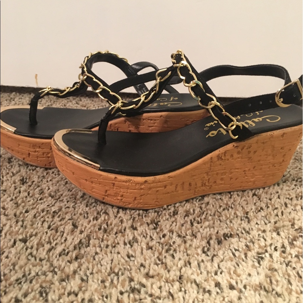 Black and gold Callisto sandals.