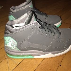 Grey and green Jordans. Like new. Barely worn.