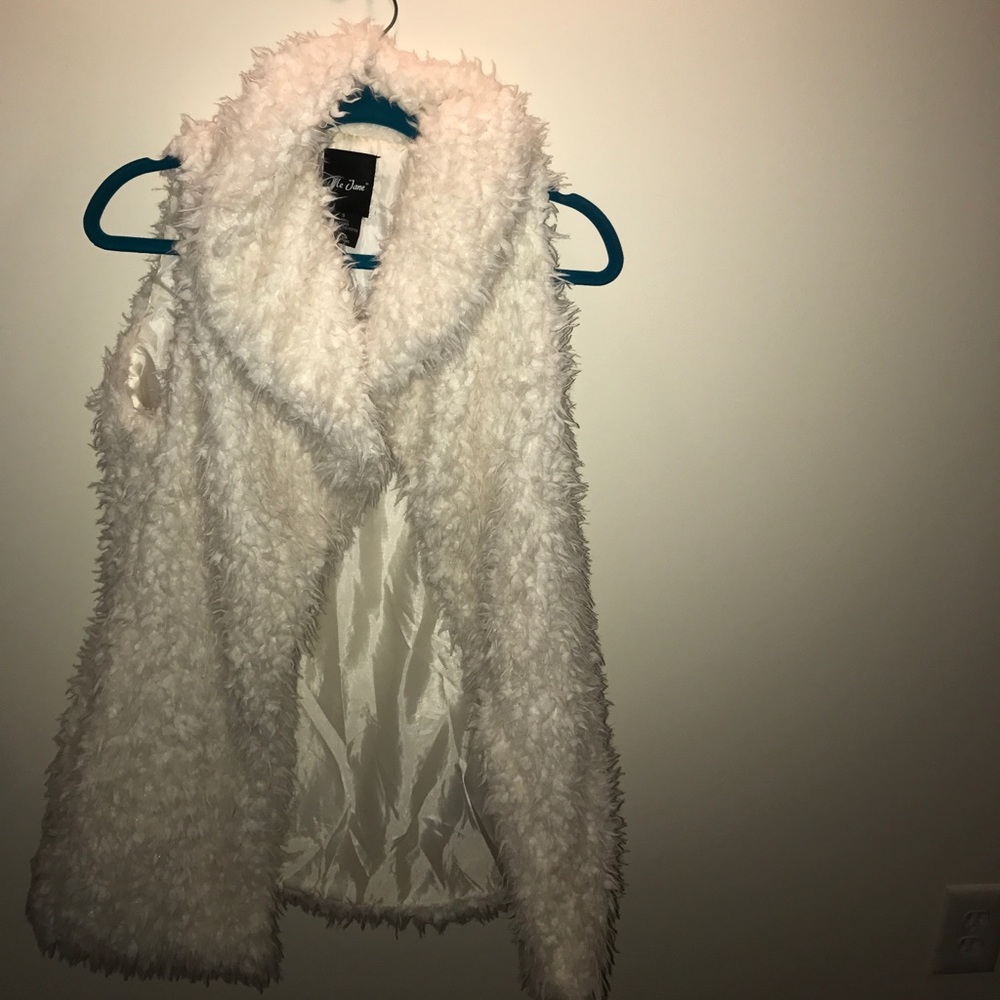 White fur vest