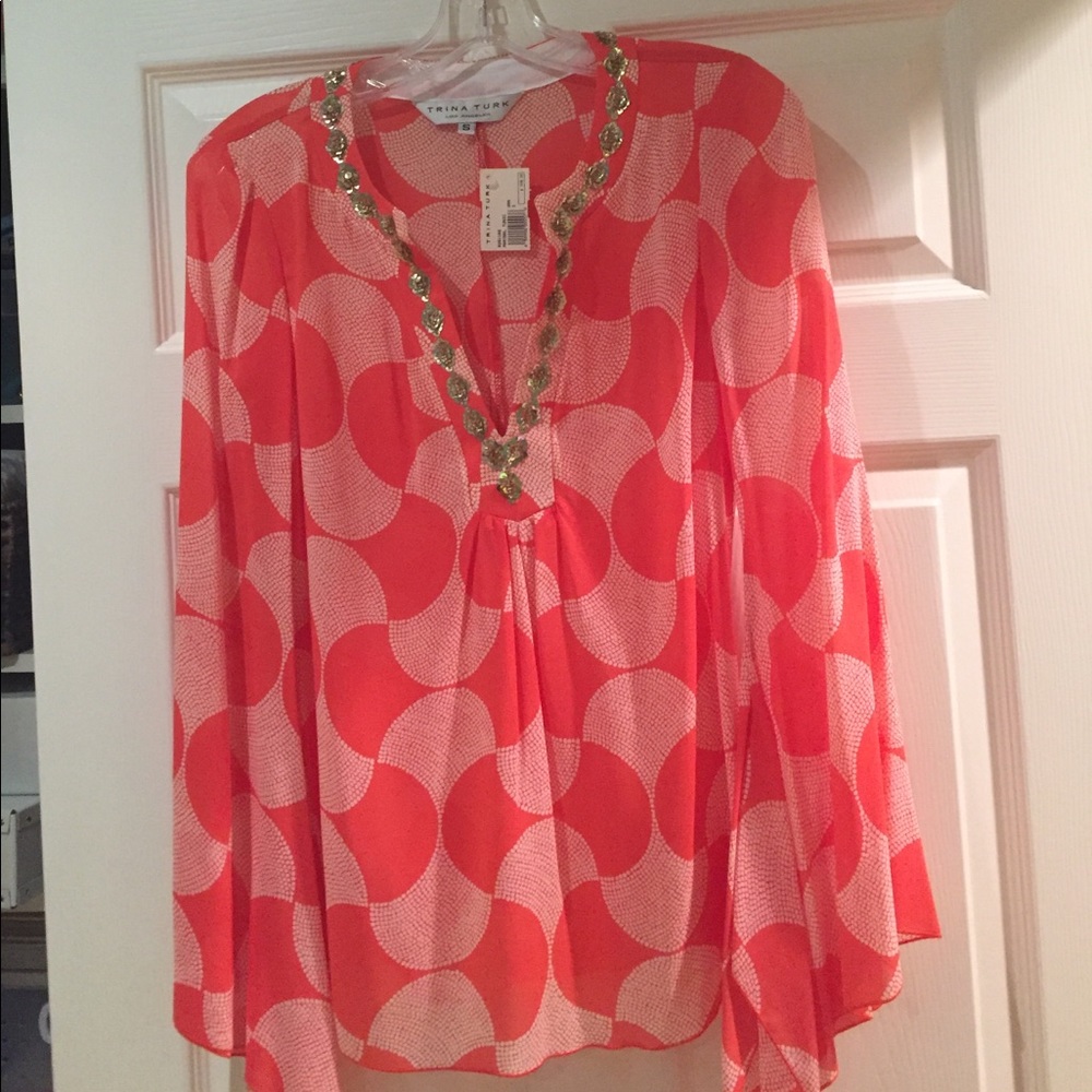 Brand new Trina Turk  blouse orange in color .