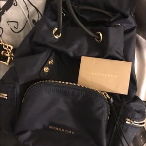 Burberry rucksack in navy blue in small.