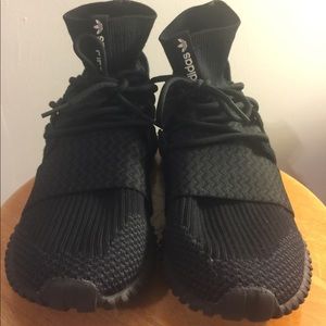 Black adidas tubular doom.