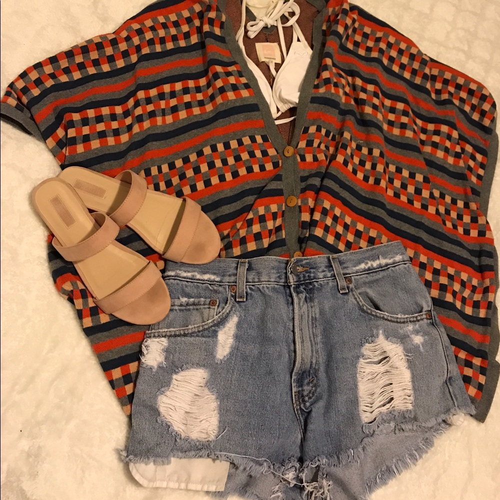 Poncho and white turtleneck sweater