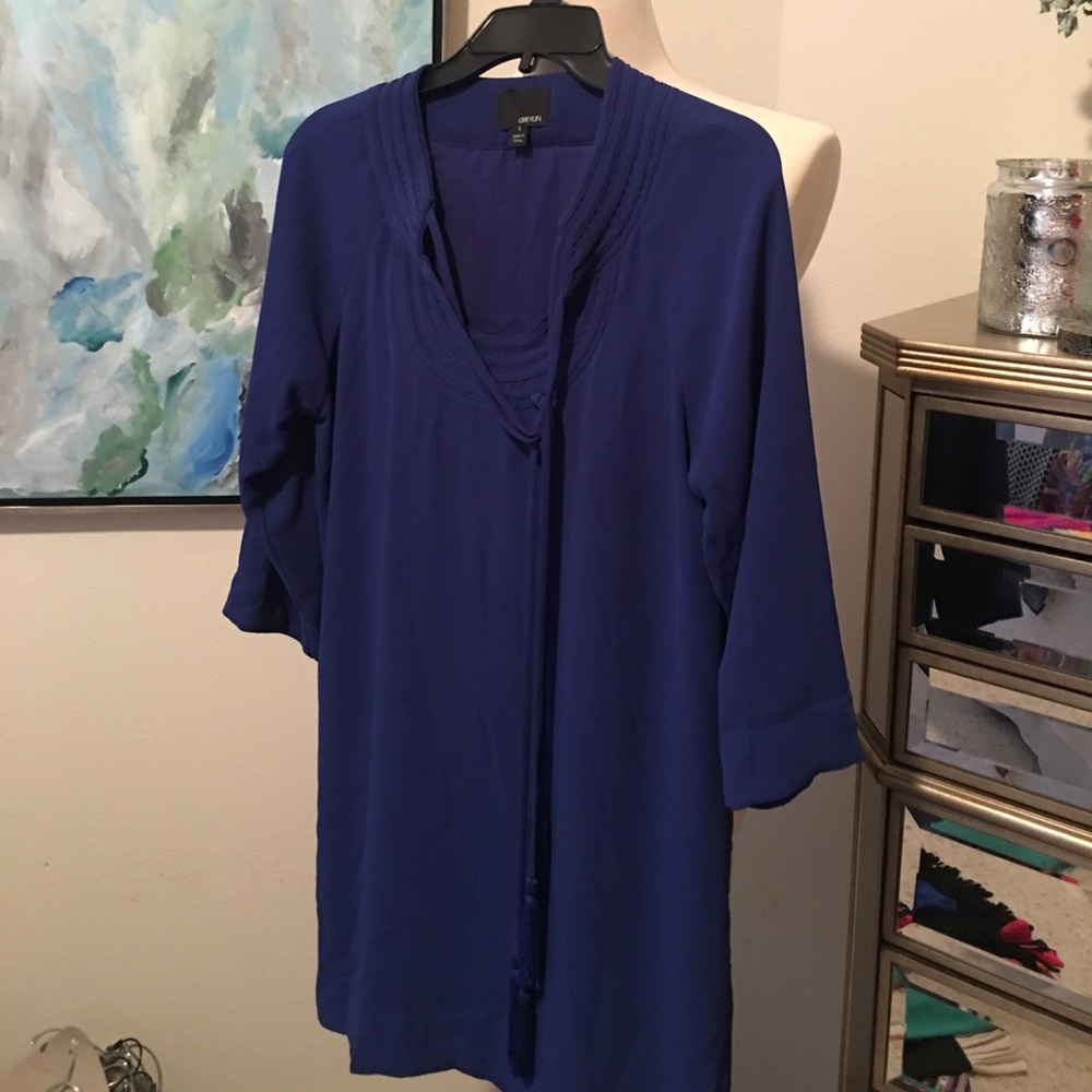 Royal blue dress with tassel.