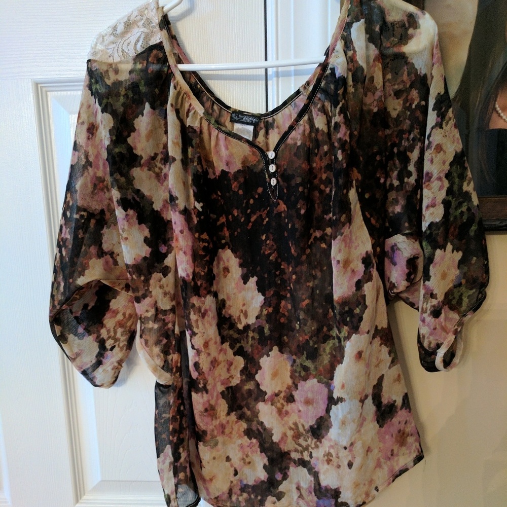 Neutral colored floral shirt with lace shoulders