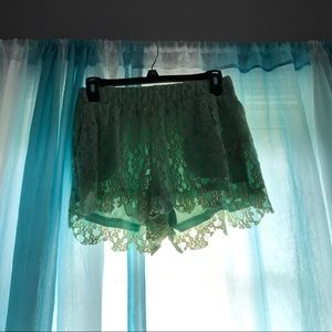 Pastel green lace shorts