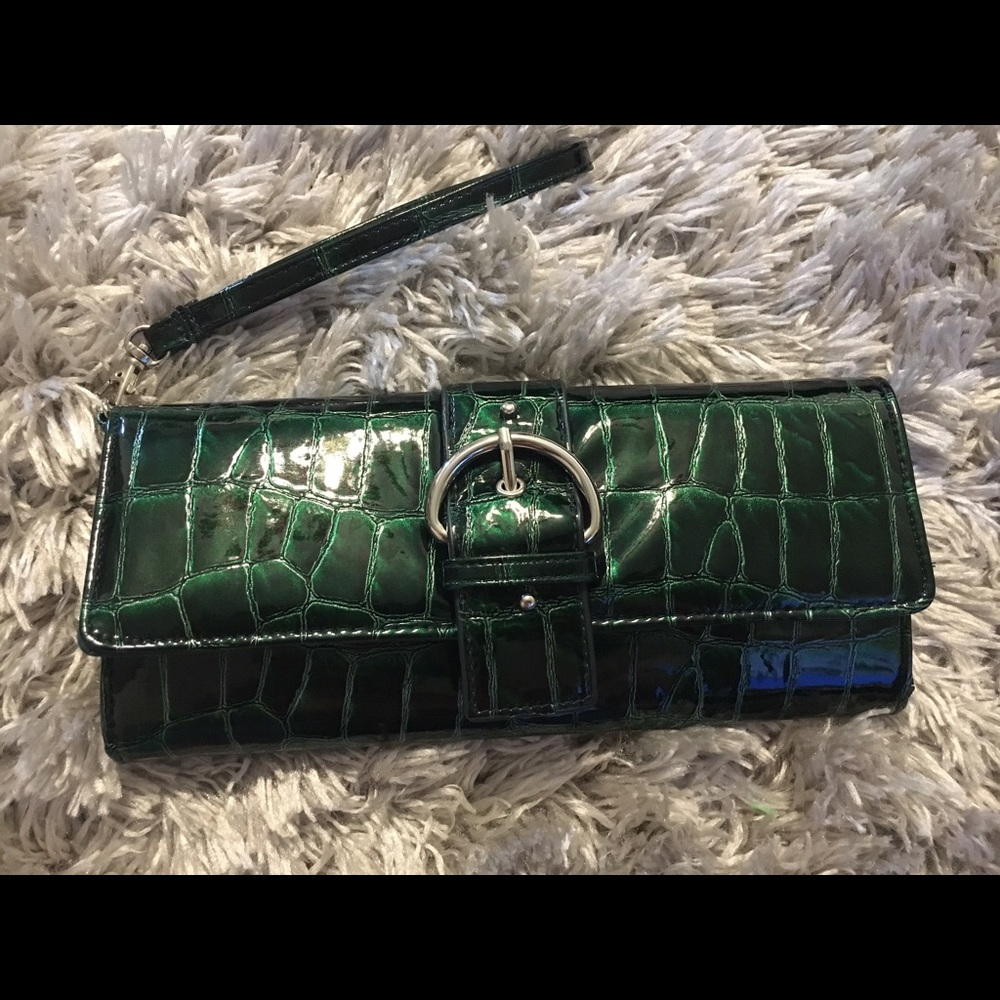 Emerald green crocodile clutch wristlet.used once