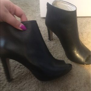 Never worn, store display leather peak toe bootie