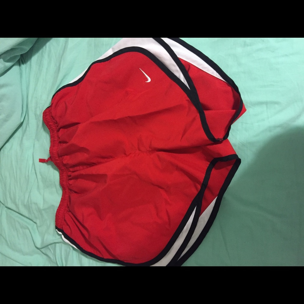 red nike shorts, size medium