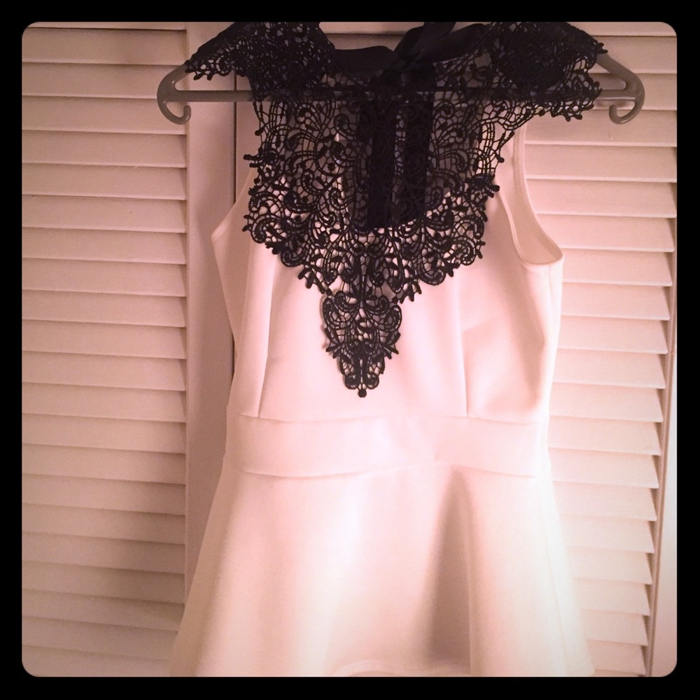 White top with lace opening.