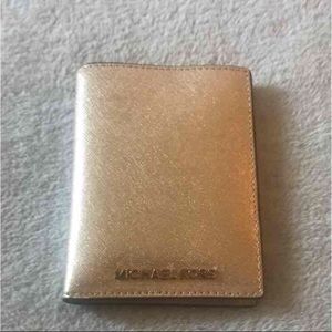Michael Kors gold passport case