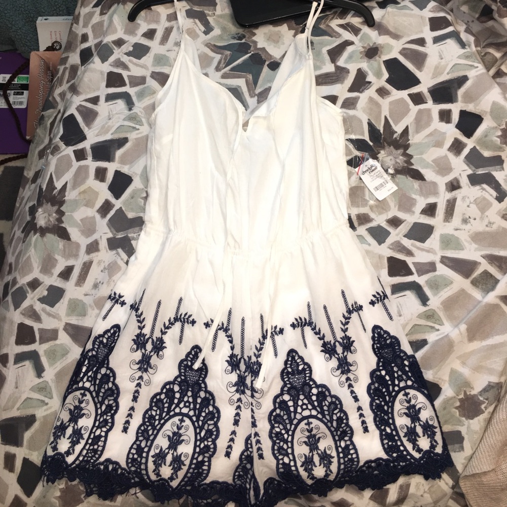 White romper with navy embroidery! NWT