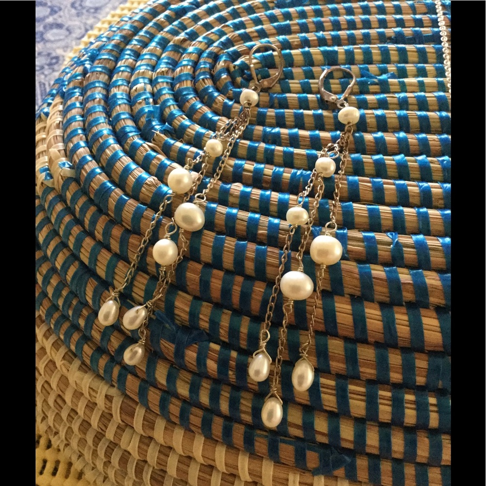 Three strands hanging pearls on gold clasp wire