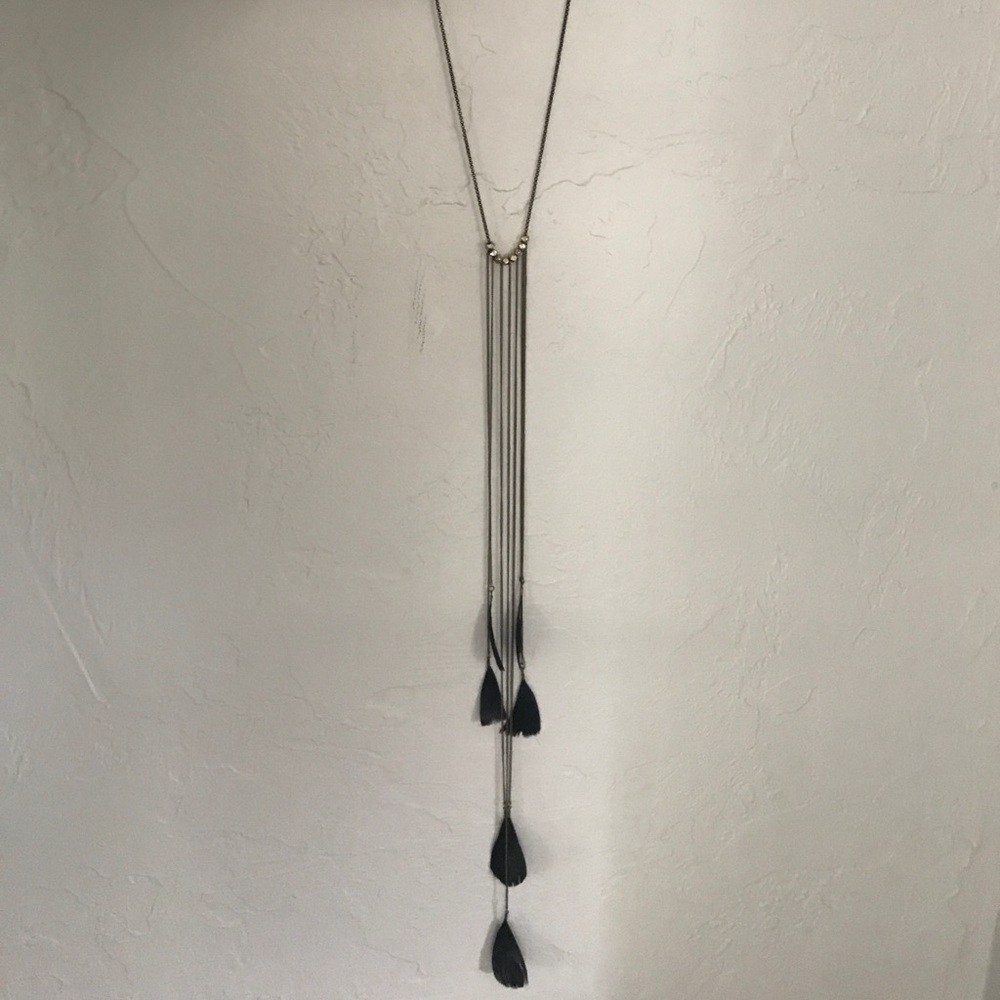 Gold chained lariat style necklace with feathers