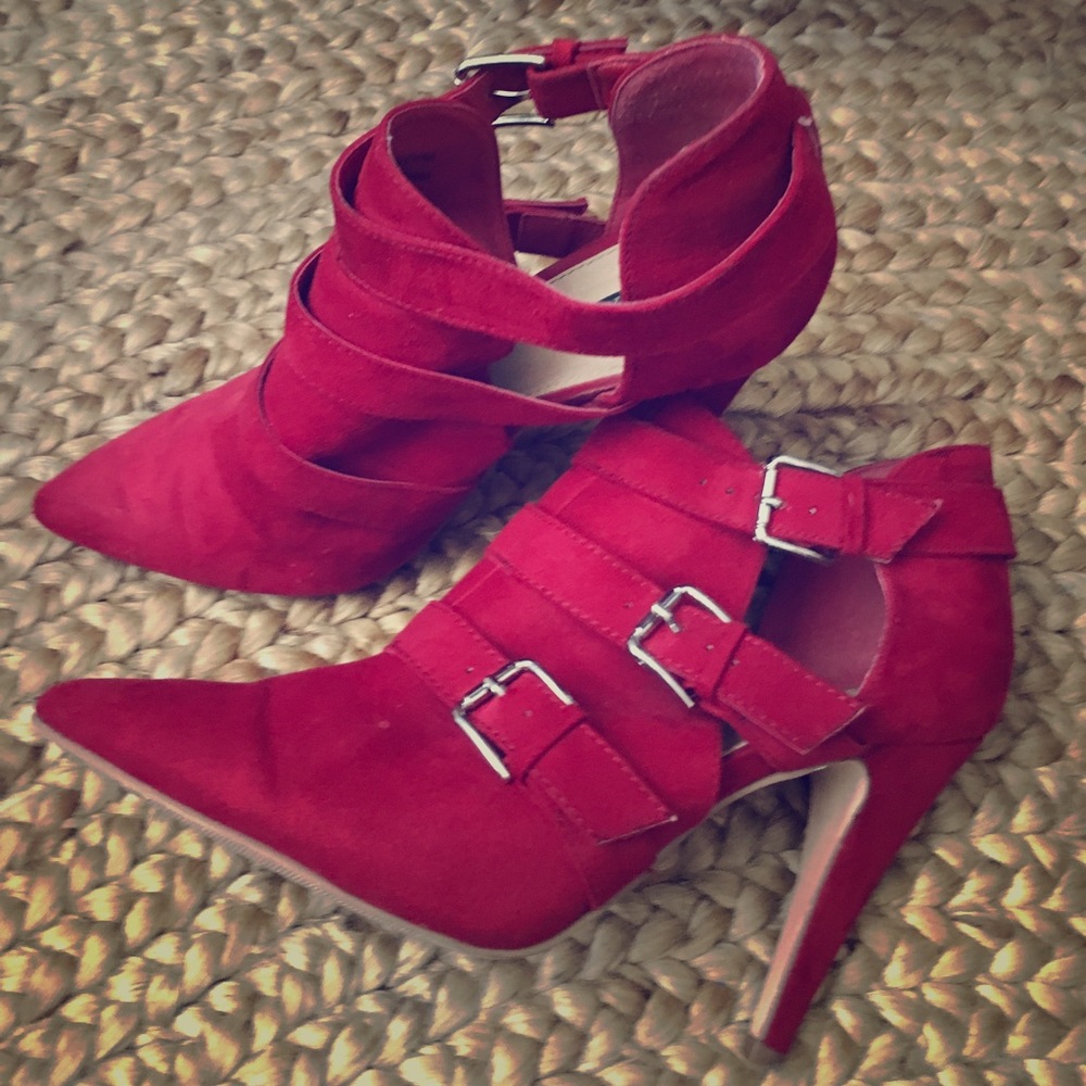 Pointed toe red buckle heels