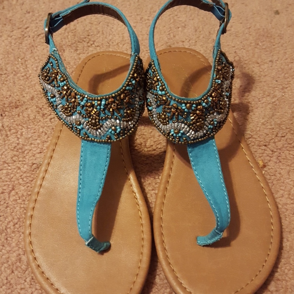 Turqouise sandals with brown accents