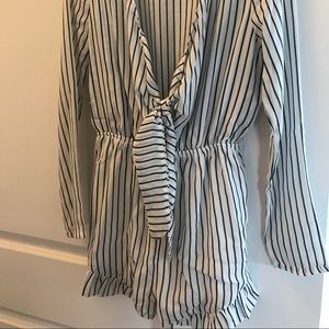 Depri romper- tear in seam. Easily repaired.