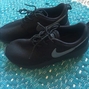 Black and grey Nike Roshe Ones