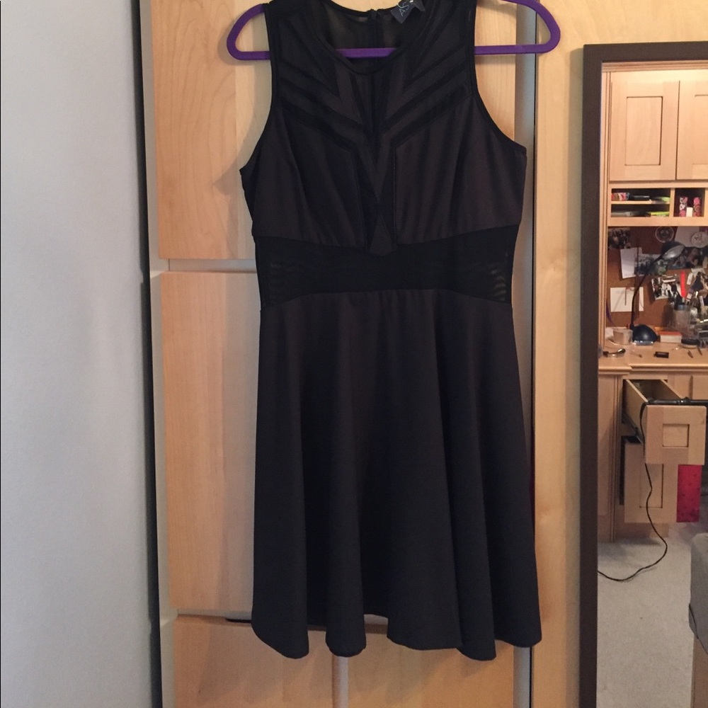 Black dress with mesh filled cut outs