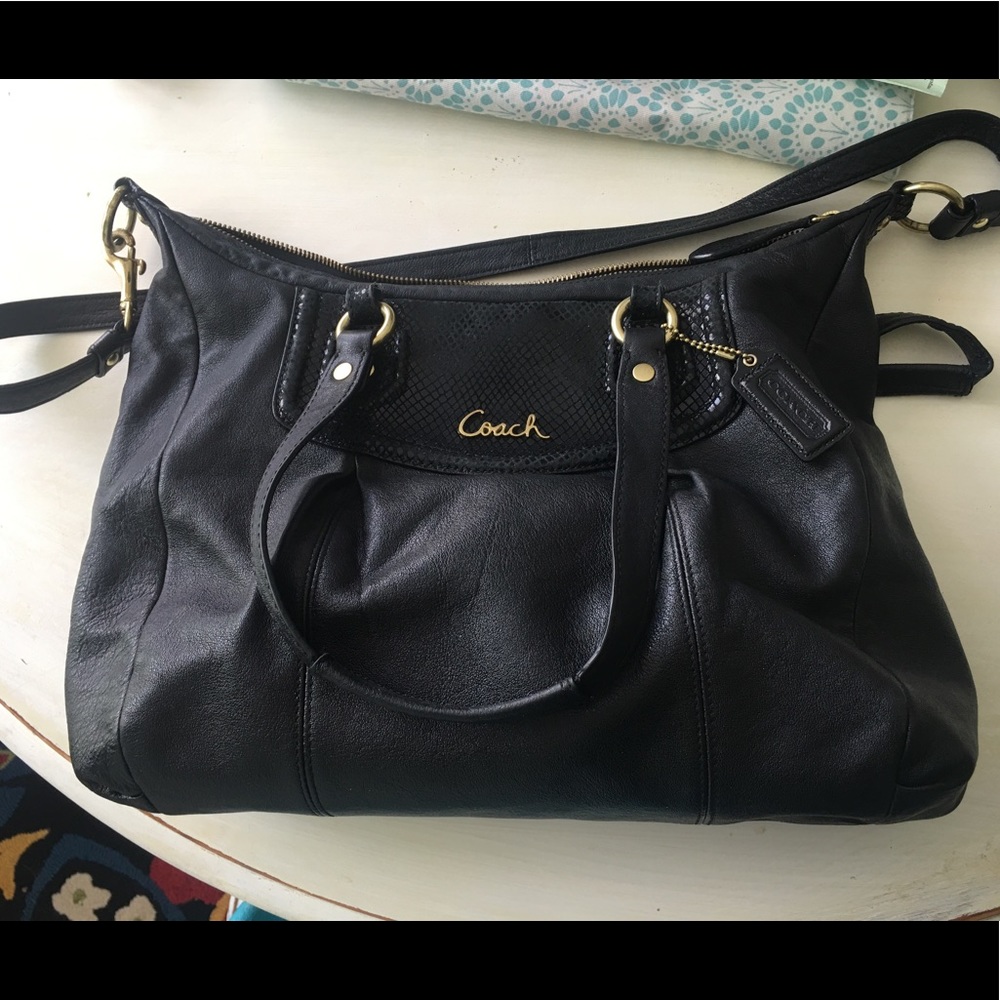 Lightly used coach purse with strap