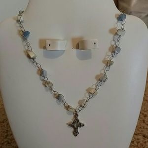 Cross necklace with blue and white gray stones