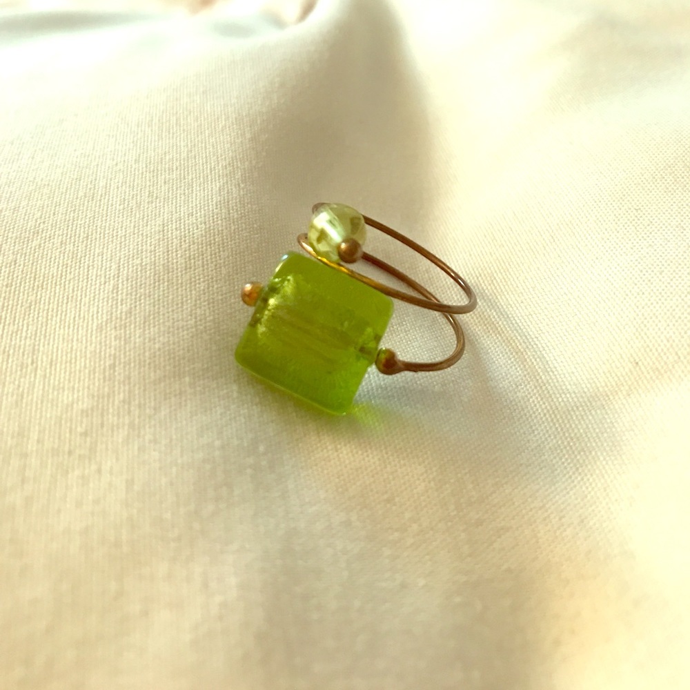Green and copper colored ring