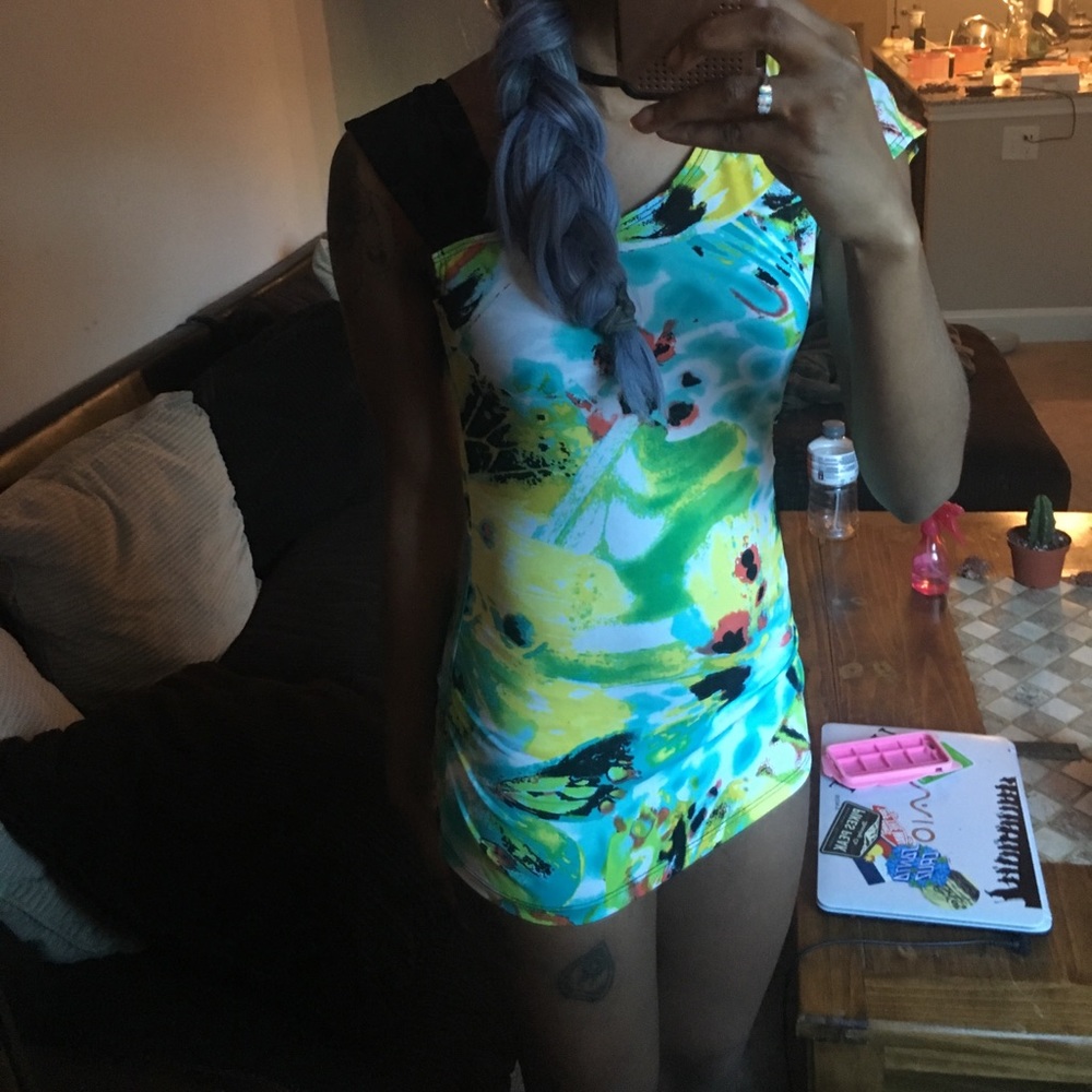 Super cute abstract top, has one short sleeve NWOT