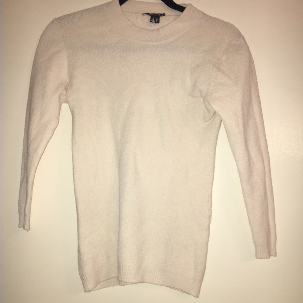 Cream Thyesken theory sweater.