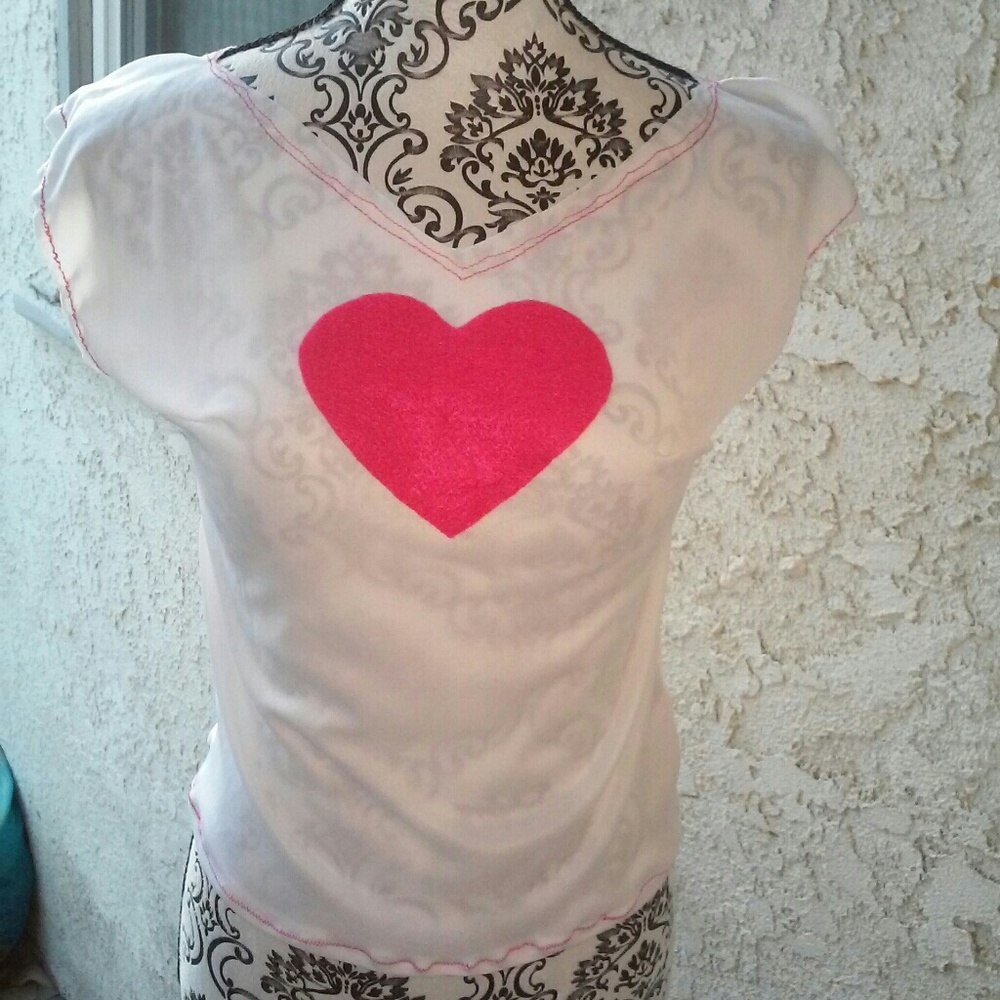 white blouse with pink heart