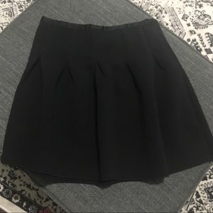 Black mini skirt with pleats