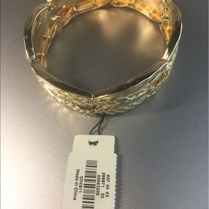 Gold tone Bracelet Wear with a black sleeves top.