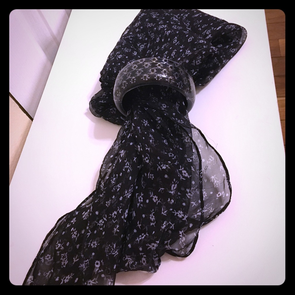 Sheer scarf and black costume bracelet