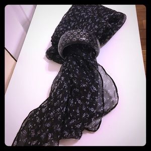 Sheer scarf and black costume bracelet