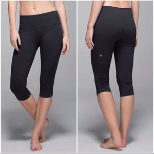 Two pairs of lululemon Capri leggings.